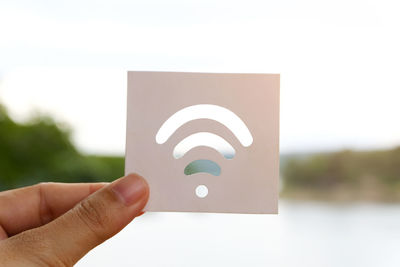 Close-up of hand holding paper