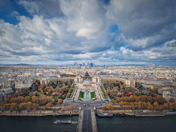 Aerial panoramic view from the eiffel tower height to the paris cityscape, france. seine river