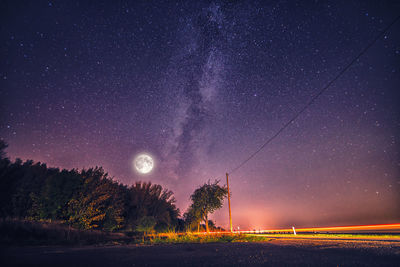 Scenic view of star field against sky at night