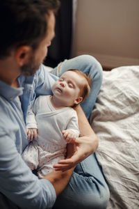 Mother and daughter baby on bed