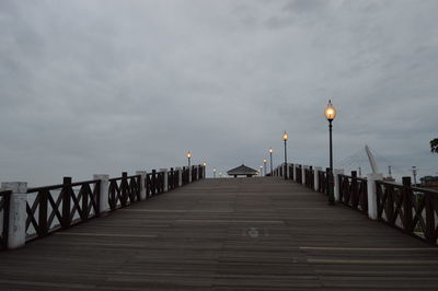 Pier over sea against sky