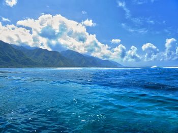 Scenic view of sea against blue sky