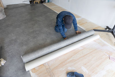 High angle view of man standing on floor