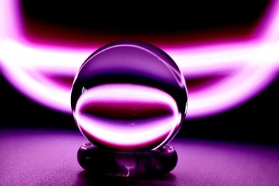 Close-up of crystal ball on glass