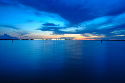 Scenic view of sea against sky at dusk