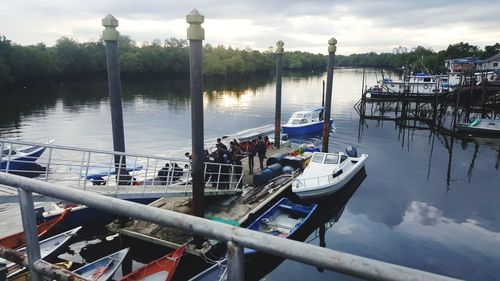 Boats moored at harbor