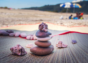 Close-up of cake on sand at beach