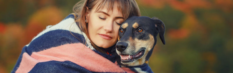 Young woman with dog on field