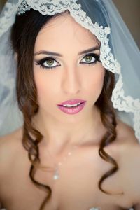 Portrait of beautiful young bride wearing veil