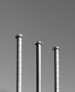 Low angle view of smoke stack against sky