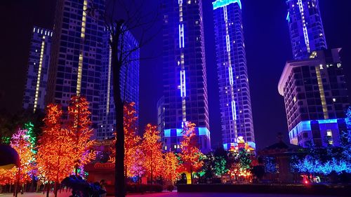 Low angle view of illuminated building at night
