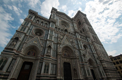 Low angle view of ornate building against sky