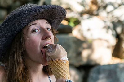 Portrait of young woman ice cream cone