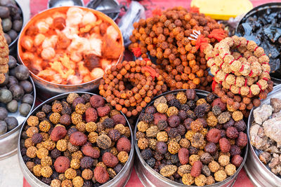 Holy rudraksha seed garland selling at street at morning