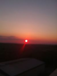 Scenic view of sea against clear sky during sunset