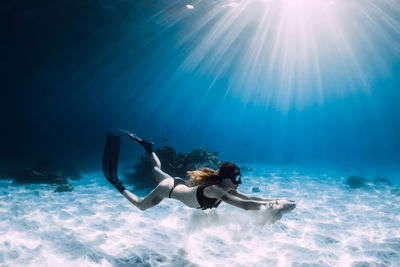 Woman swimming in sea