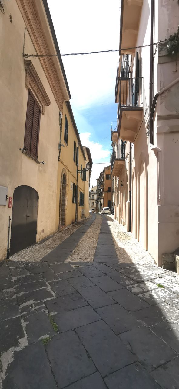 NARROW ALLEY AMIDST BUILDINGS