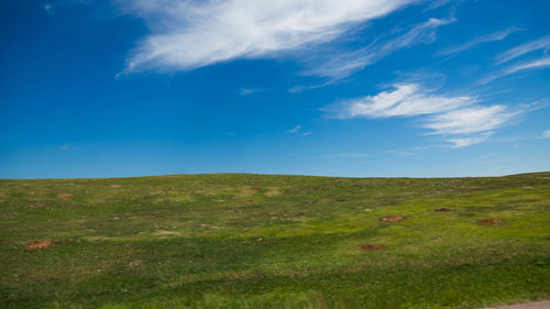 Countryside landscape against blue sky