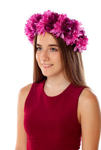 Portrait of beautiful woman with pink flower against white background