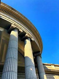 Low angle view of building against blue sky