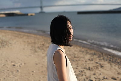 Rear view of woman on beach