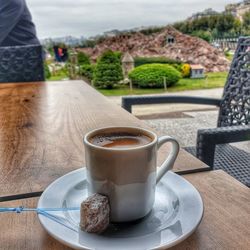 Close-up of coffee cup on table