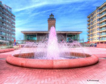 Fountain with buildings in background