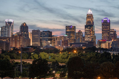 Illuminated buildings in city at night