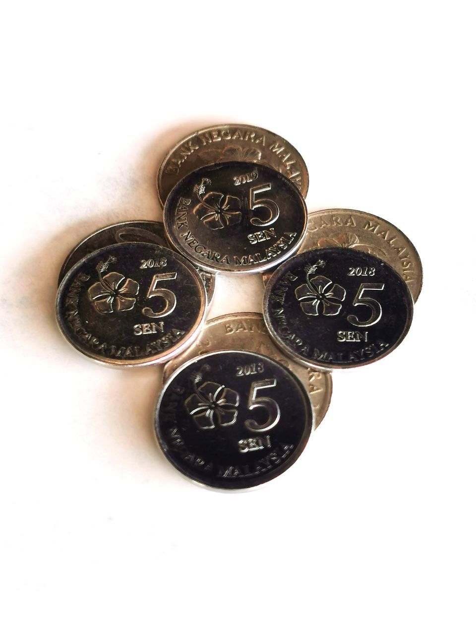 money, finance, coin, wealth, currency, business, number, indoors, metal, no people, white background, studio shot, close-up, cash, still life