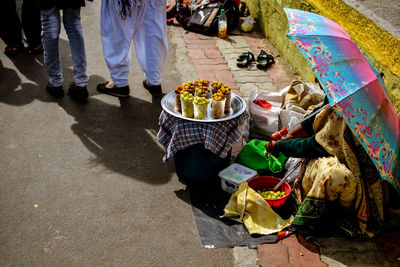 High angle view of woman selling food in market