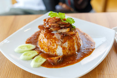 Close-up of rice and red pork