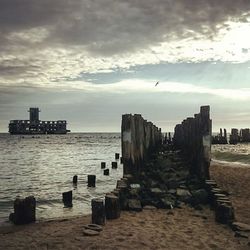 Scenic view of sea against cloudy sky