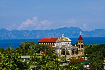 View of buildings against blue sky