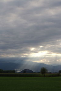 Scenic view of landscape against cloudy sky