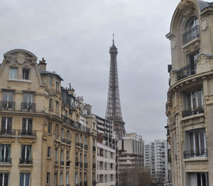 Low angle view of buildings in city against sky