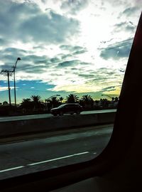 View of road against cloudy sky