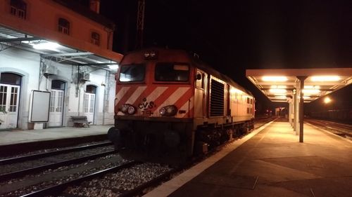 Train at railroad station at night