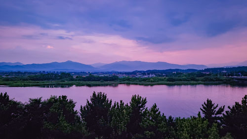 Scenic view of lake against sky during sunset