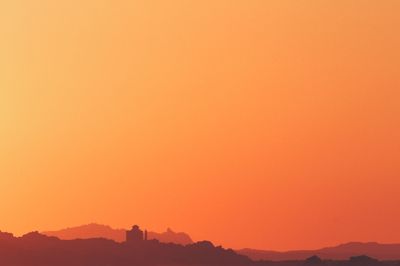 Scenic view of mountains at sunset