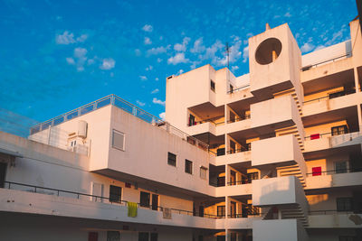 Low angle view of buildings against blue sky