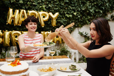 Young woman having food at restaurant