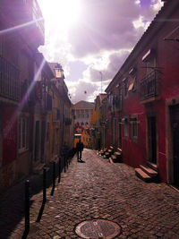 Street amidst buildings against sky