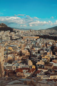 High angle view of buildings in town against sky