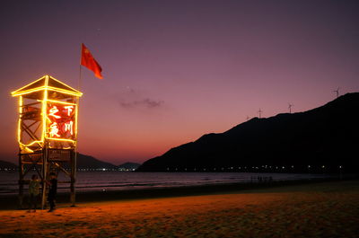 Illuminated lifeguard tower overlooking nan'ao bay, on xiachuan island.