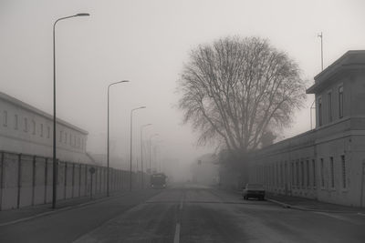 Street amidst buildings in city against sky