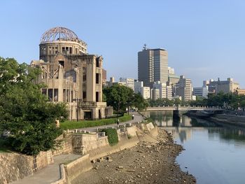 Buildings in city against clear sky