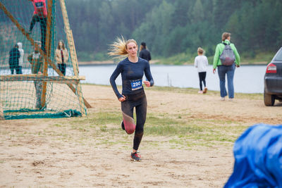 Full length of people running on land