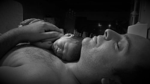 Close-up of father with newborn baby