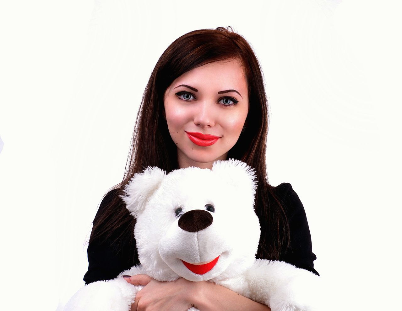 studio shot, white background, portrait, lifestyles, person, looking at camera, young adult, front view, leisure activity, headshot, holding, young women, waist up, casual clothing, indoors, copy space, head and shoulders, long hair