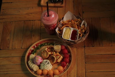 High angle view of fruits in basket on table